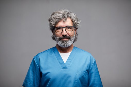 A doctor in blue scrubs