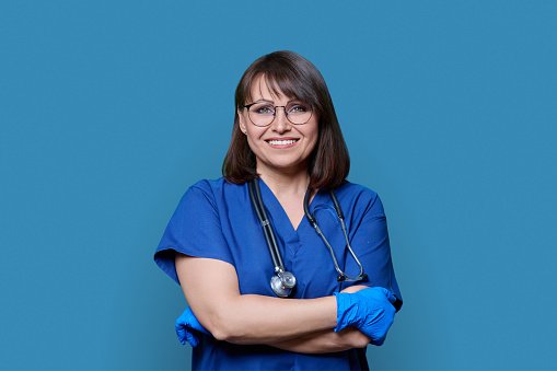 A confident clinician with arms crossed