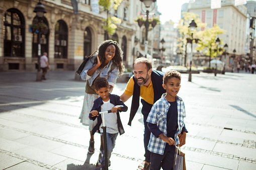 A family out together in a town square