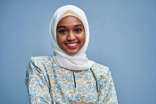 A young GP wearing a hijab, smiling