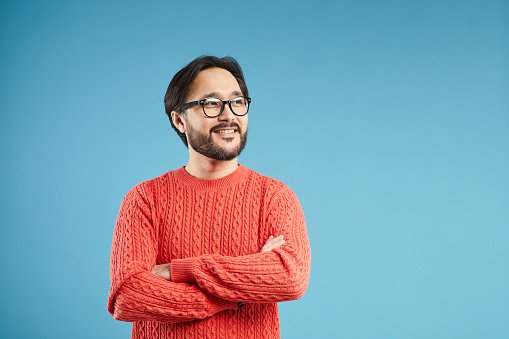 A GP in a red jumper weighing his options