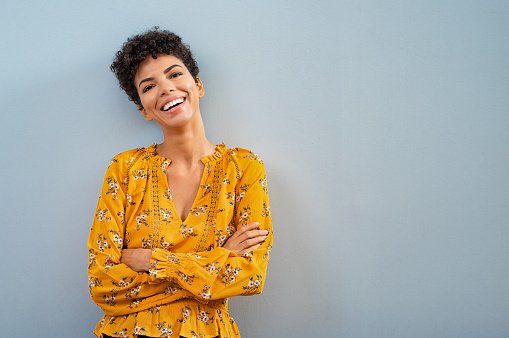 A GP smiling warmly